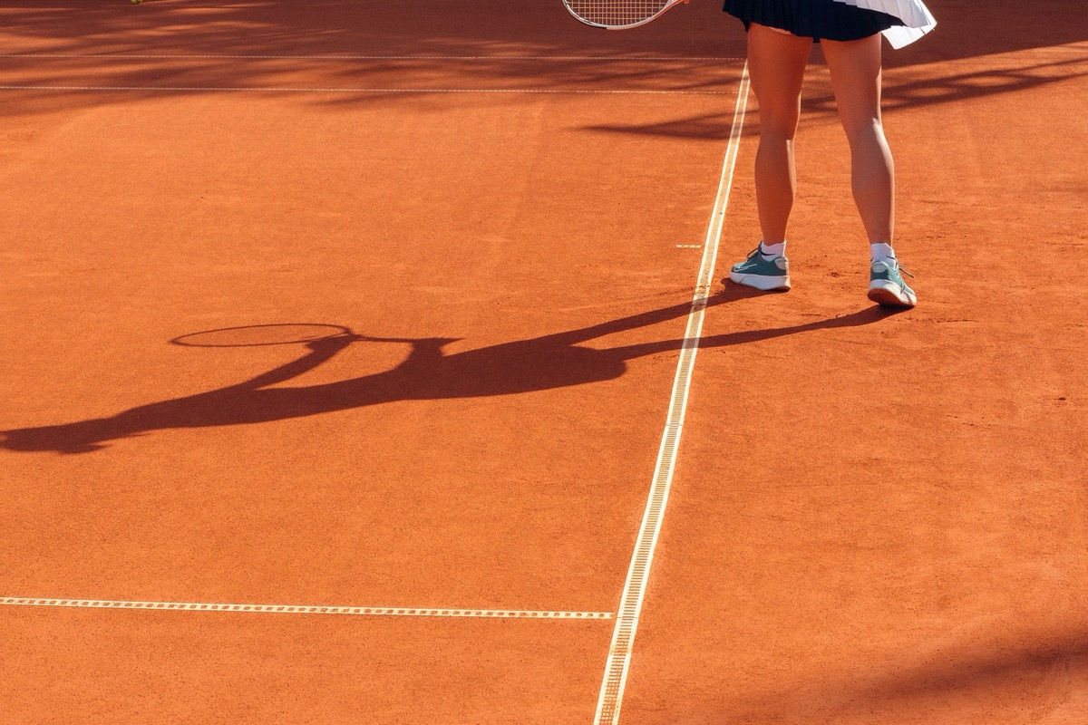 Playing tennis in the sun